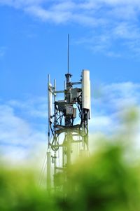 Low angle view of communications tower against sky