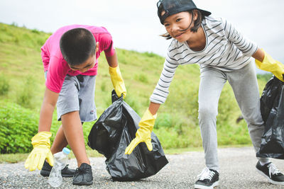 Volunteers collecting garbage on road