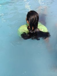 High angle view of woman swimming in pool