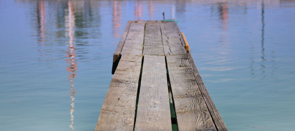 Close-up of wooden jetty in lake