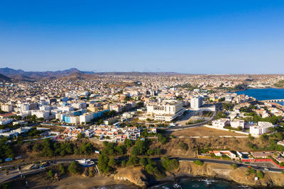 High angle shot of townscape against clear blue sky