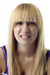 Close-up portrait of a beautiful young woman over white background