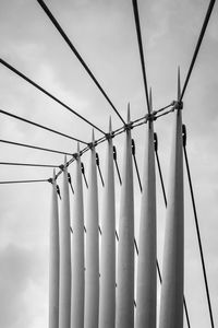 A black and white image of a section of a footbridge.