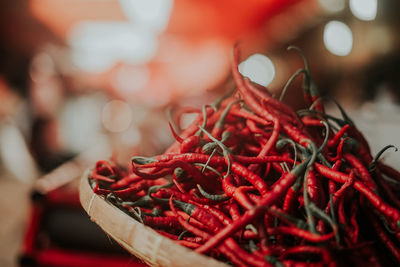 Close-up of red chili peppers in basket