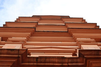 Low angle view of stack of building against sky