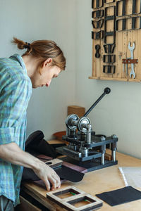 Woman working on table at home