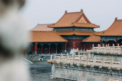 Exterior of temple building against clear sky