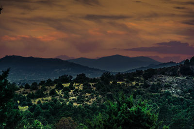 Scenic view of landscape against sky during sunset