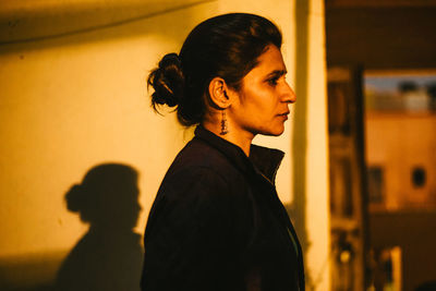 Portrait of a young woman looking away