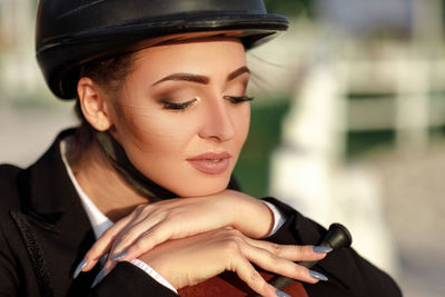 Close-up of young man wearing hat