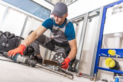 Low angle view of mid adult man working in workshop