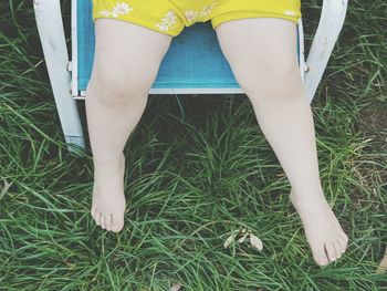 Low section of woman standing on ground