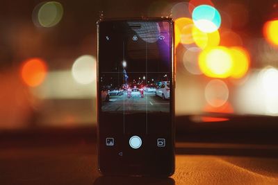 Close-up of illuminated camera