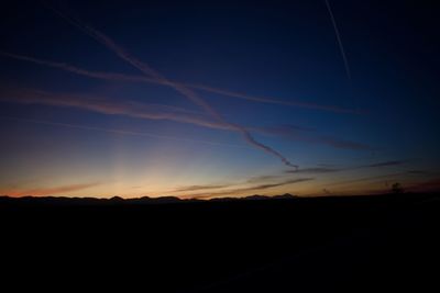 Silhouette landscape against sky during sunset