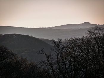 Scenic view of silhouette mountains against clear sky