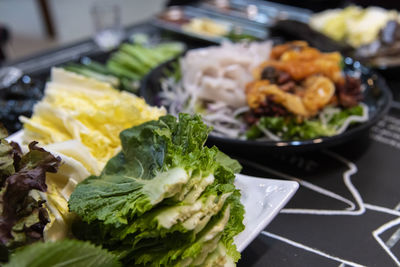 Close-up of seafood and vegetables served on table