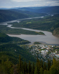 High angle view of river amidst landscape against sky