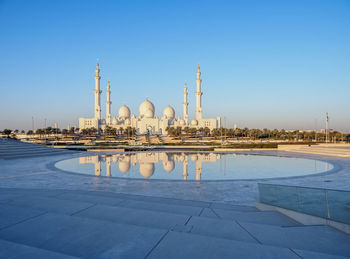 View of temple against clear blue sky