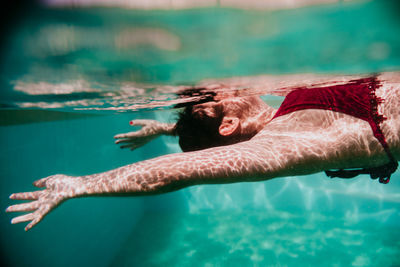 Woman swimming in sea