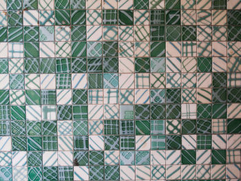 Full frame shot of green and white patterned tile wall