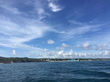 Scenic view of sea against cloudy sky