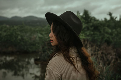 Close-up of woman by lake