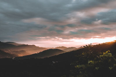 Scenic view of mountains against dramatic sky