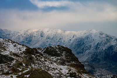 Scenic view of mountains against sky during winter