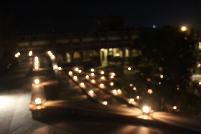 Defocused image of illuminated city at night