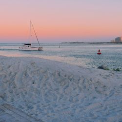 Sailing past the jetty at sunset in ponce inlet, florida