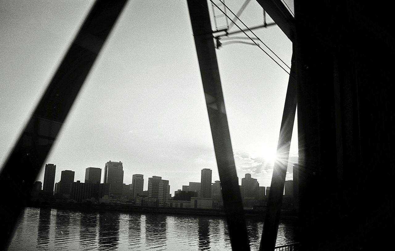 low angle view, built structure, architecture, sky, water, river, outdoors, city, no people, bridge - man made structure, day, nature