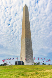 Low angle view of monument against cloudy sky