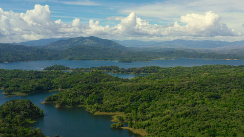 Scenic view of lake and mountains against sky