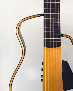 Close-up of guitar against white background