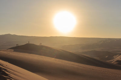 Scenic view of landscape against sky during sunset