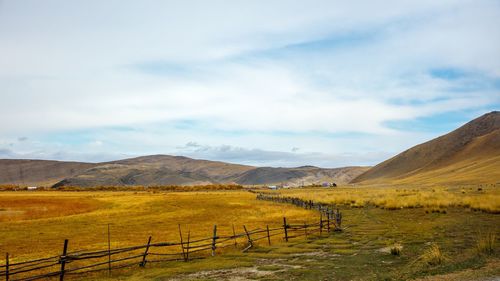 Scenic view of landscape and mountains against sky
