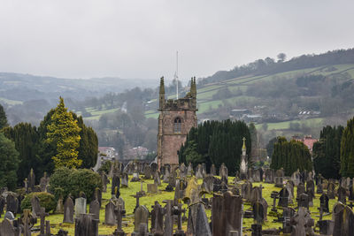 Panoramic view of trees and buildings against sky