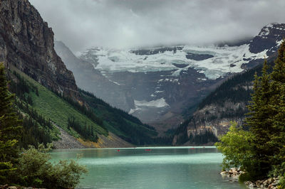 Scenic view of lake and mountains against sky