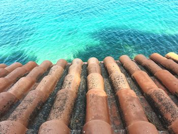 High angle view of clay tiles next to sea