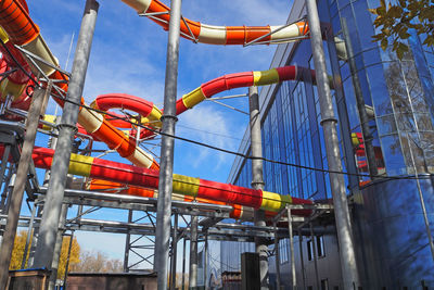 Bright colored water slides in the water park against the blue sky. high quality photo