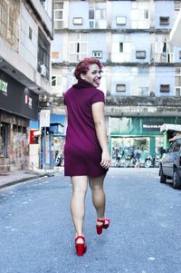 Full length of woman standing on street