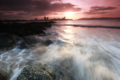 Scenic view of sea against sky during sunset