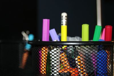 Close-up of colorful pencils in desk organizer