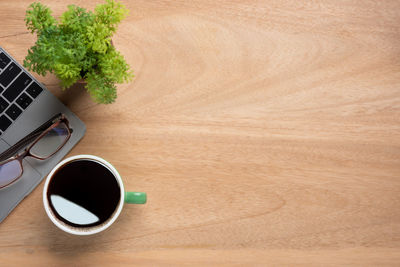 High angle view of coffee cup on table