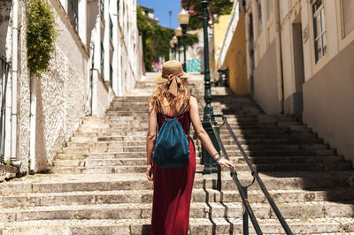 Rear view of woman walking outdoors