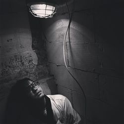 Portrait of woman against wall