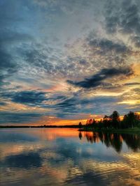 Scenic view of lake against romantic sky at sunset