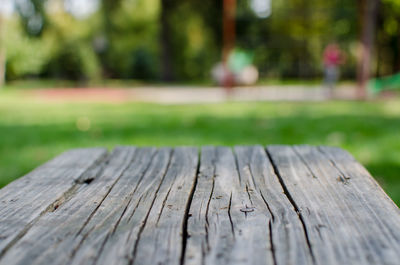 Close-up of wooden table in the park