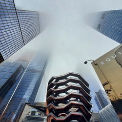 Low angle view of modern buildings against sky