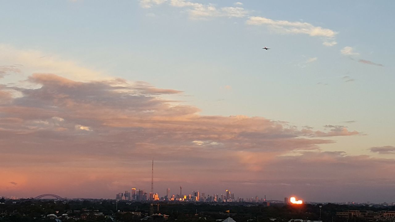 VIEW OF CITY AGAINST SKY DURING SUNSET